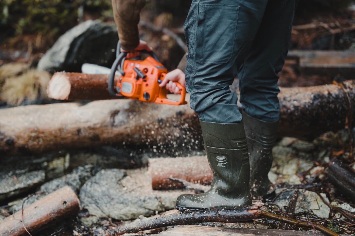 Man cutting tree in the Grindstone Work Pant | SITKA Gear