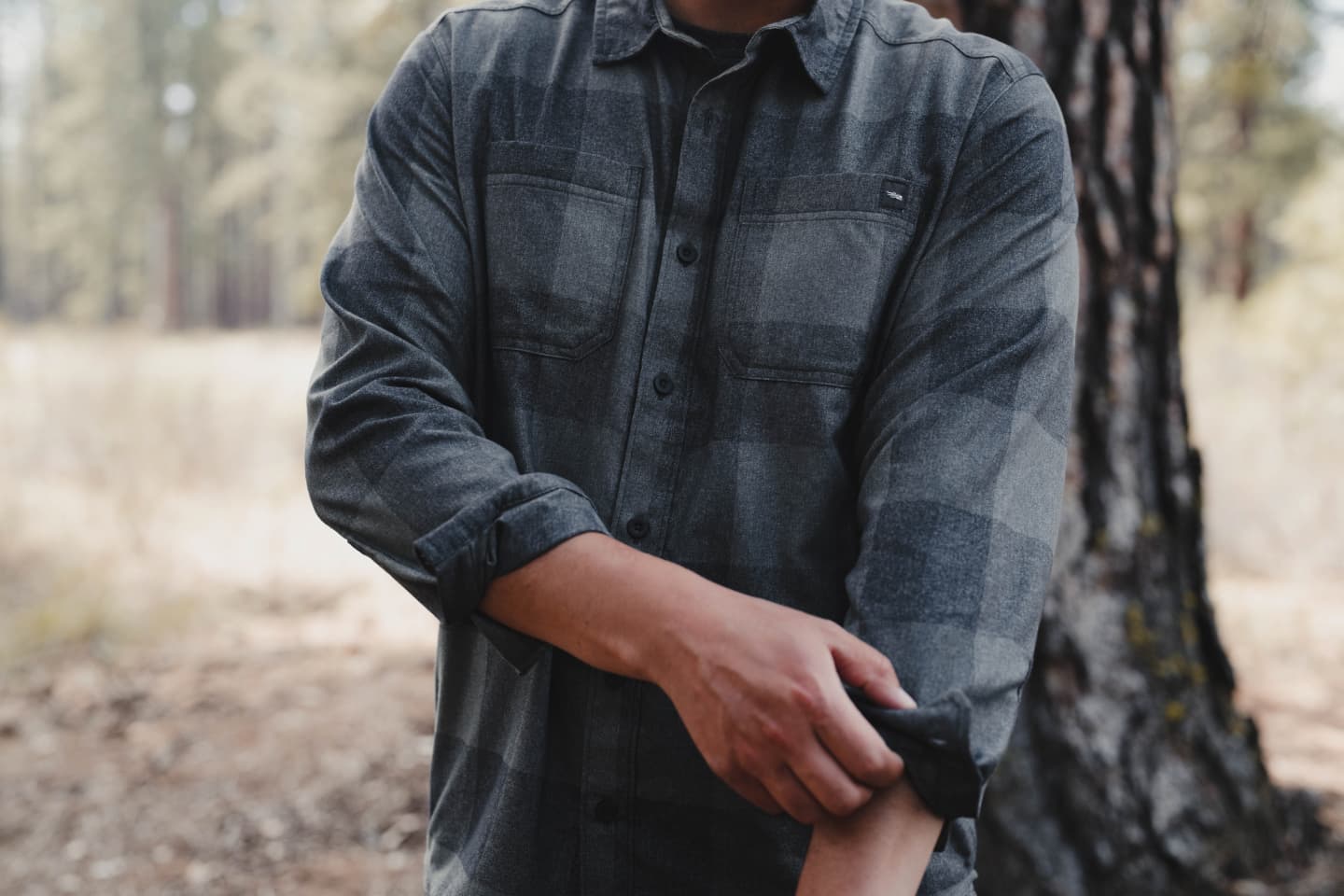 Man working hard in the Grange Flannel | SITKA Gear